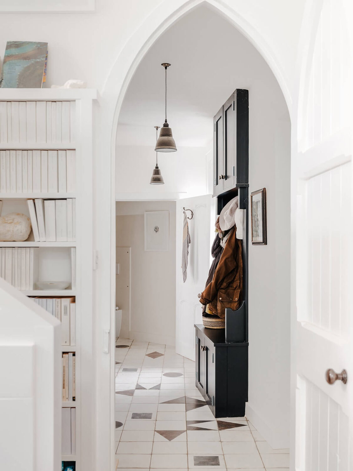 A Coastal White Painter's Home with Reclaimed Features in Cornwall 10 gothic arch