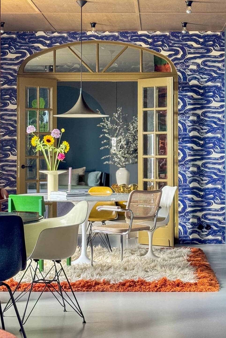 Color and Graphic Design in the Home of a Dutch Interior Stylist 20 graphic blue wallpaper in dining room
