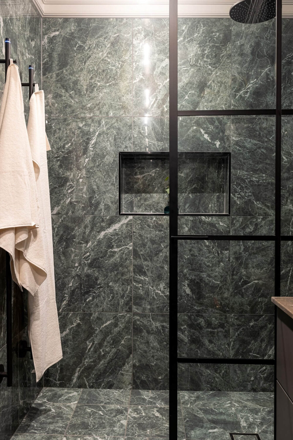 A Gray Apartment with an Industrial Glass Bedroom 19 gray bathroom with walk in shower