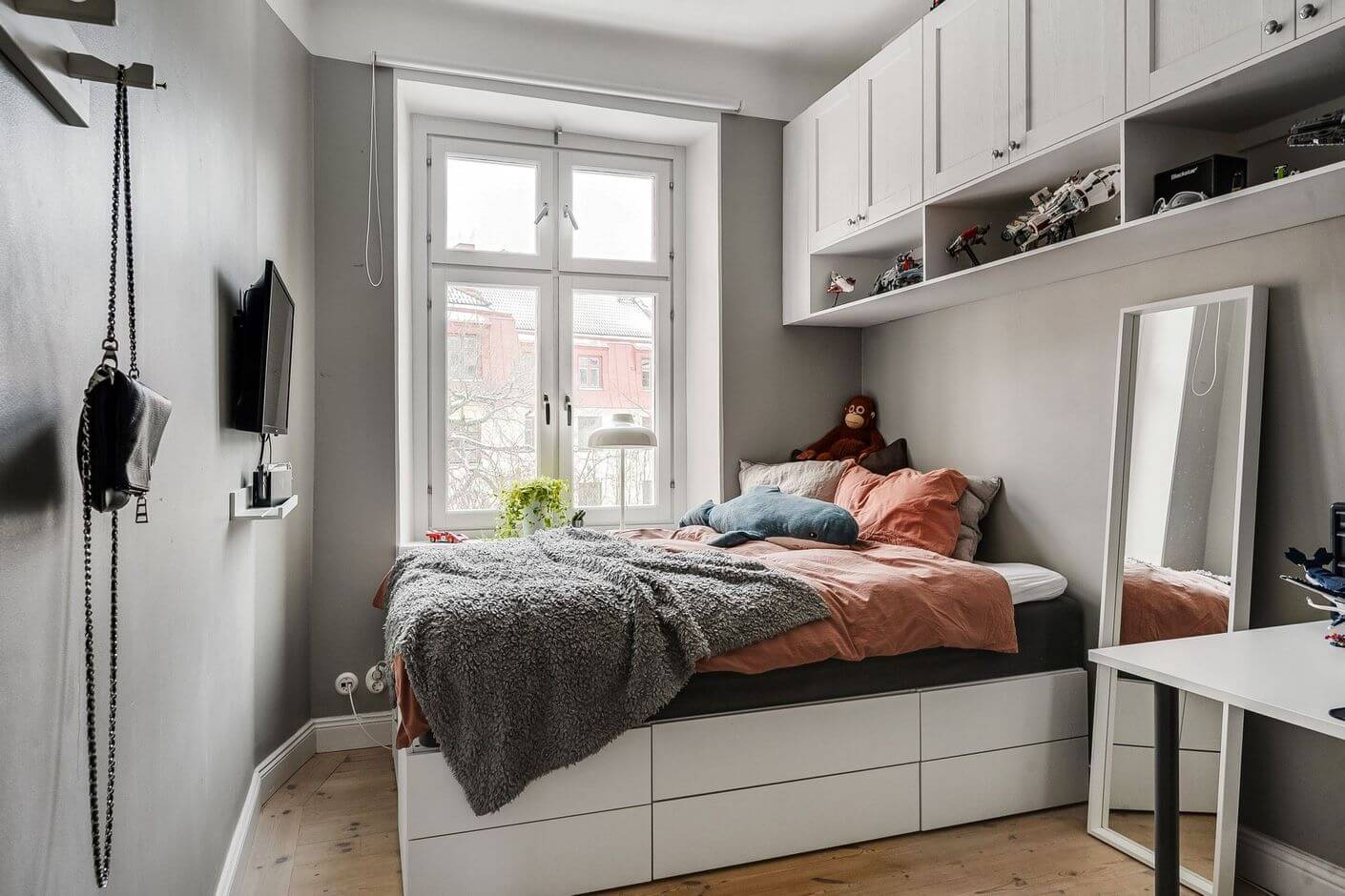 A Swedish Family Apartment with a Butter Yellow Kitchen 20 gray bedroom with wall mounted cabinets