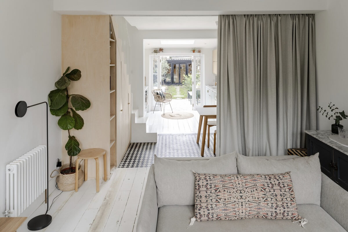 Light and Modern Spaces in a Small Victorian House 2 gray curtain seperation in white living room