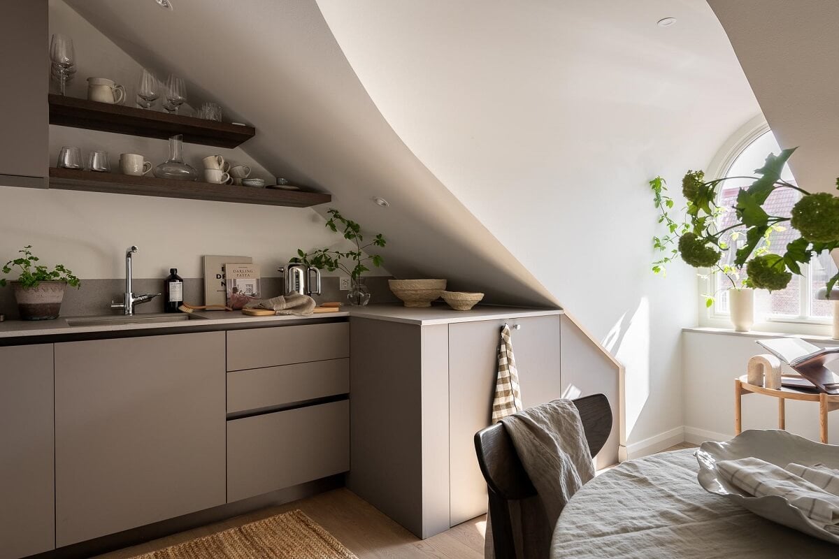 An Attic Studio Apartment with a Glass Room Divider 15 gray kitchen with shelves