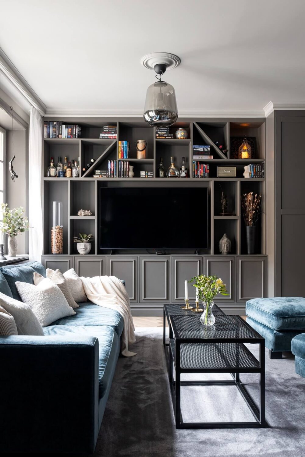 Boost Your Home's Value by Thousands with This Simple Paint Trick! 7 gray living room with custom storage system