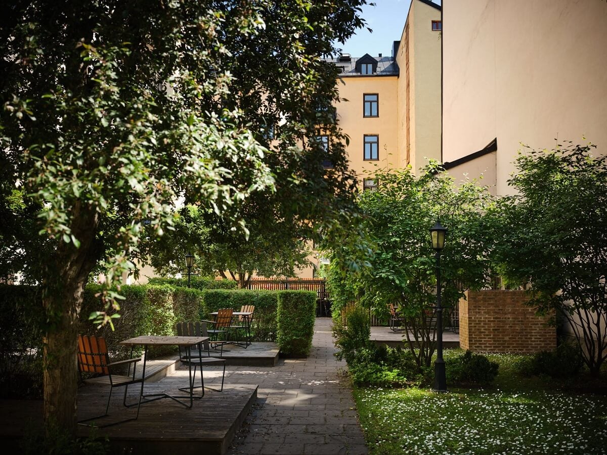 A Classic Stockholm Apartment with Floral Wallpaper 35 green courtyard stockholm apartment building nordroom