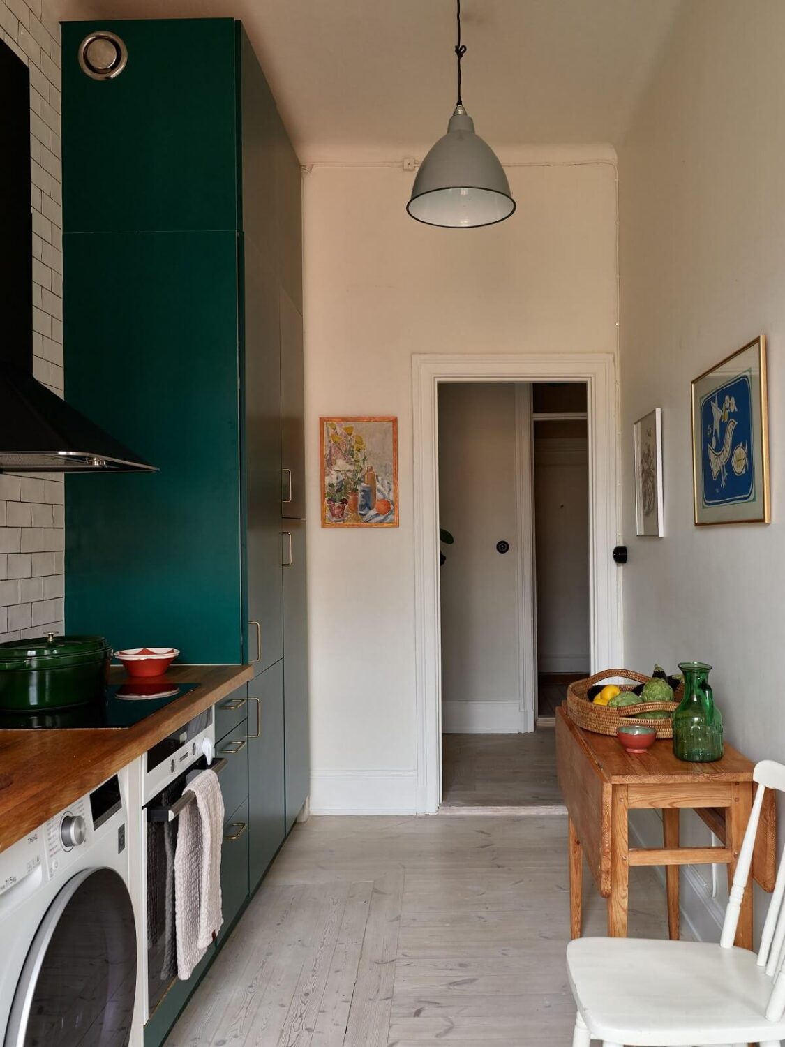 A Green Kitchen in a Gray Family Apartment 11 green kitchen with narrow table