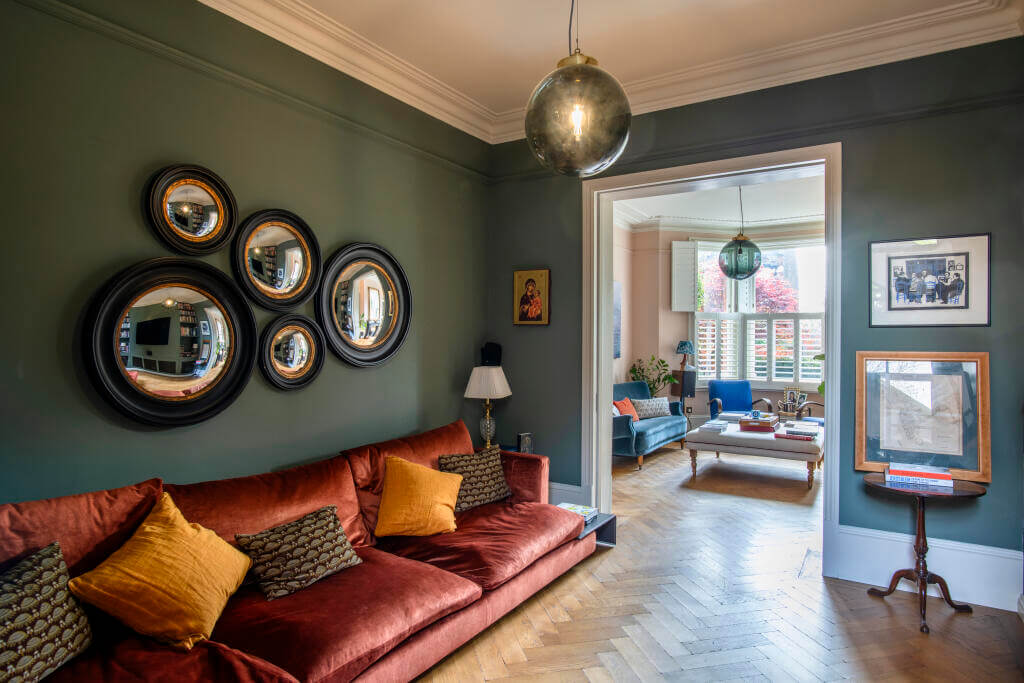 A Victorian House where the Kitchen is the Heart of the Home 6 green television room with red sofa