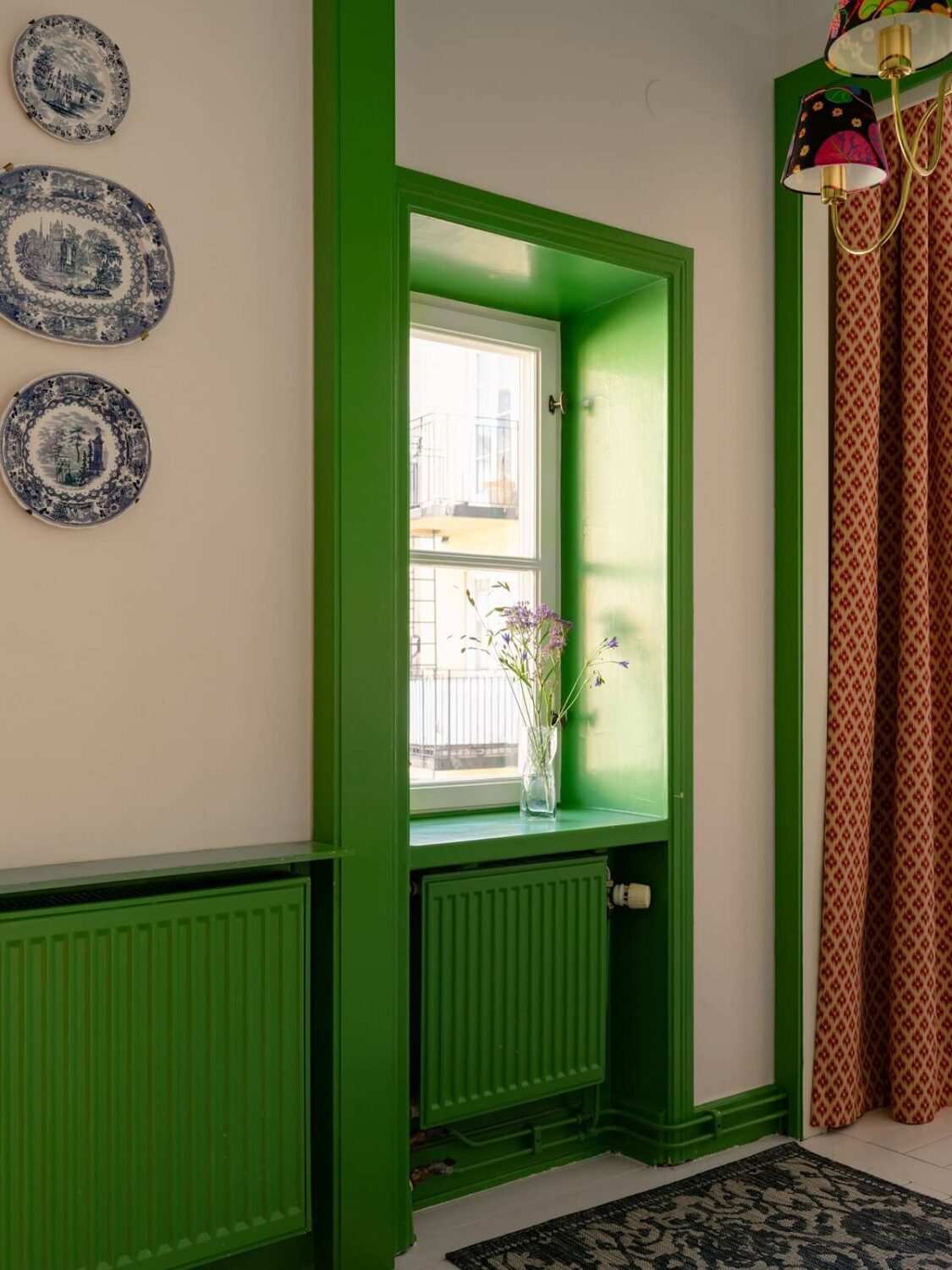 A Stockholm Apartment with Bright Green Color Accents 4 green window trims
