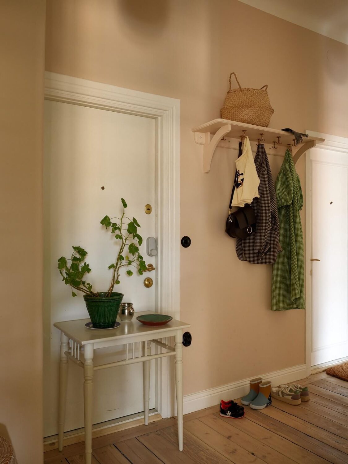A Green Kitchen in a Gray Family Apartment 32 hallway with beige walls