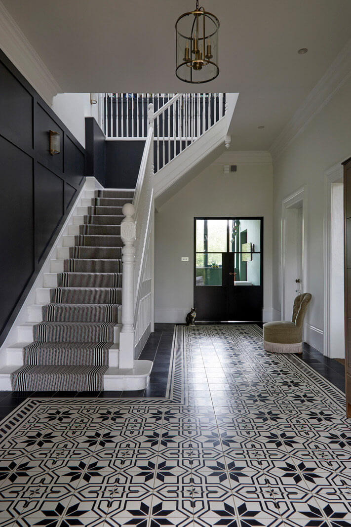 A Colorful London Family Home Renovated by Fraher & Finlay 22 hallway with black and whit tiles