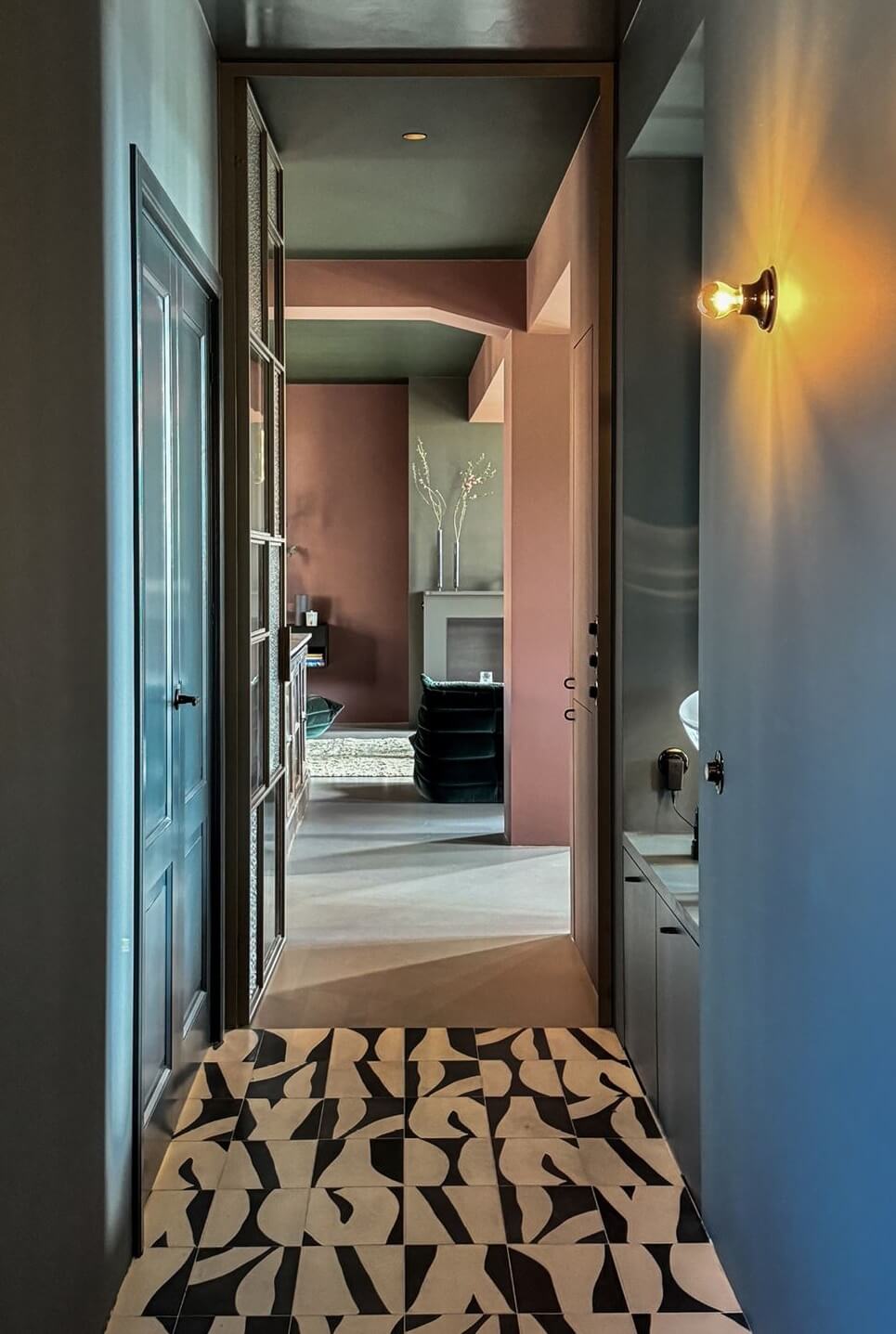 Color and Graphic Design in the Home of a Dutch Interior Stylist 39 hallway with graphic black and white tiles