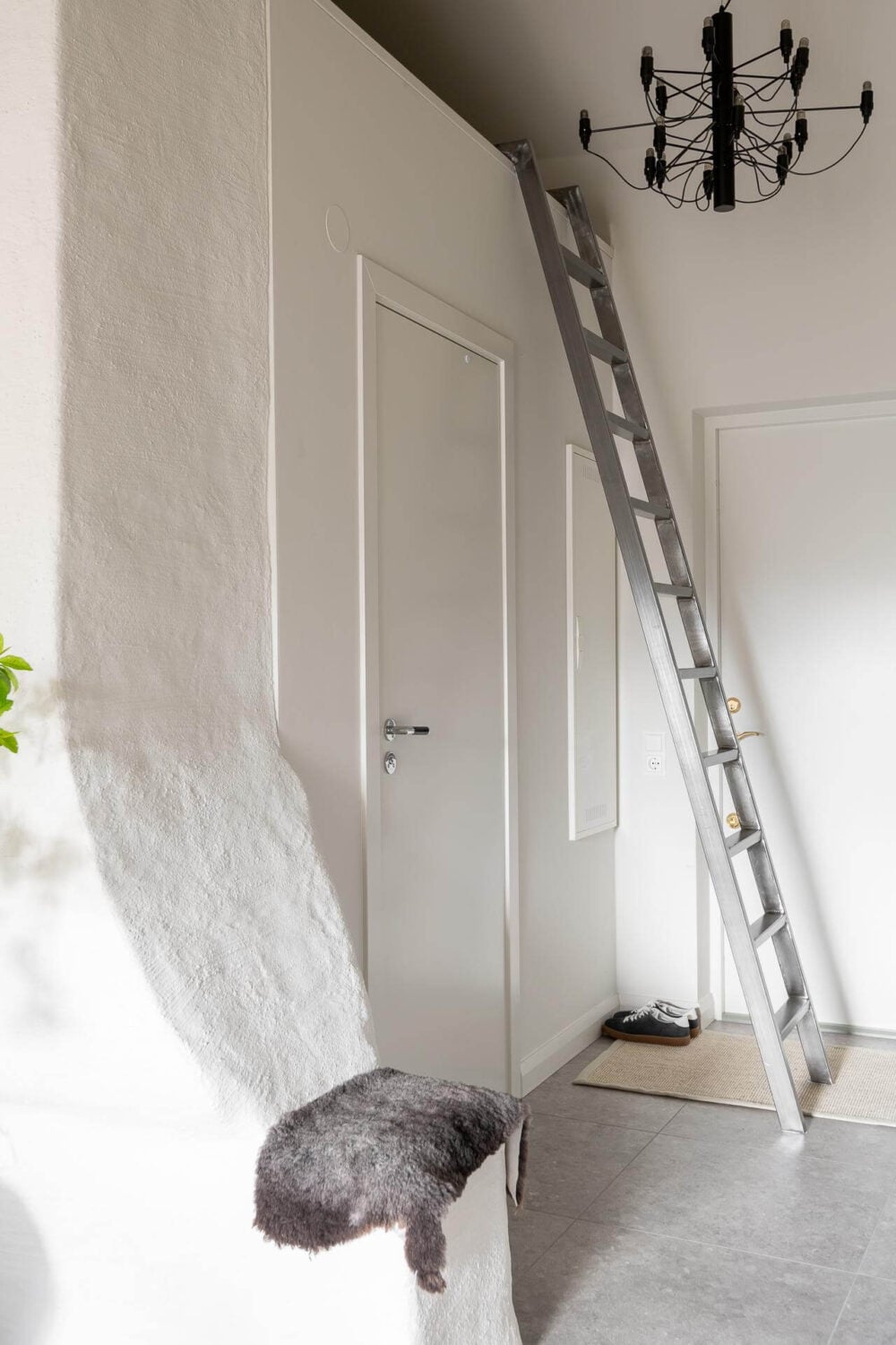 An Attic Studio Apartment with a Glass Room Divider 17 hallway with loft space
