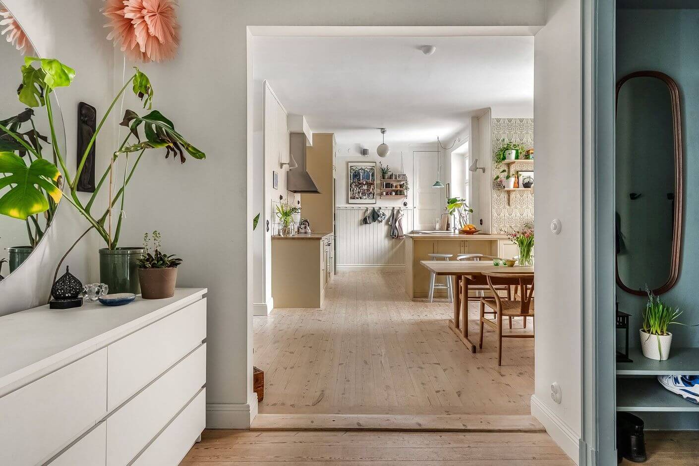 A Swedish Family Apartment with a Butter Yellow Kitchen 8 hallway with malm dresser