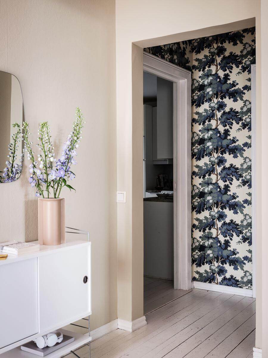 A Scandinavian Apartment with a Rust Red Bedroom 11 hallway with wallpaper