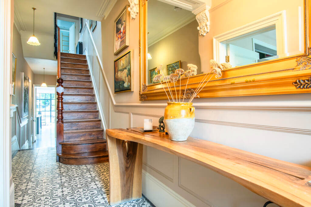 A Victorian House where the Kitchen is the Heart of the Home 8 hallway with wooden sidetable