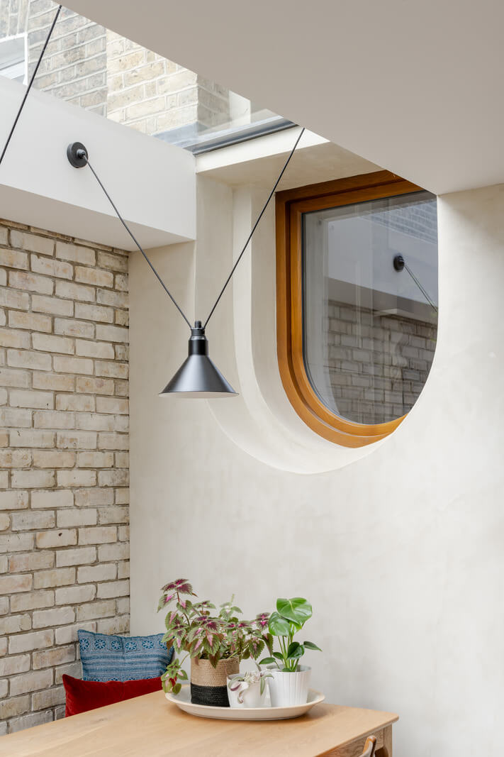 A Light London Family House with a Modern Extension 4 inner window and brick wall