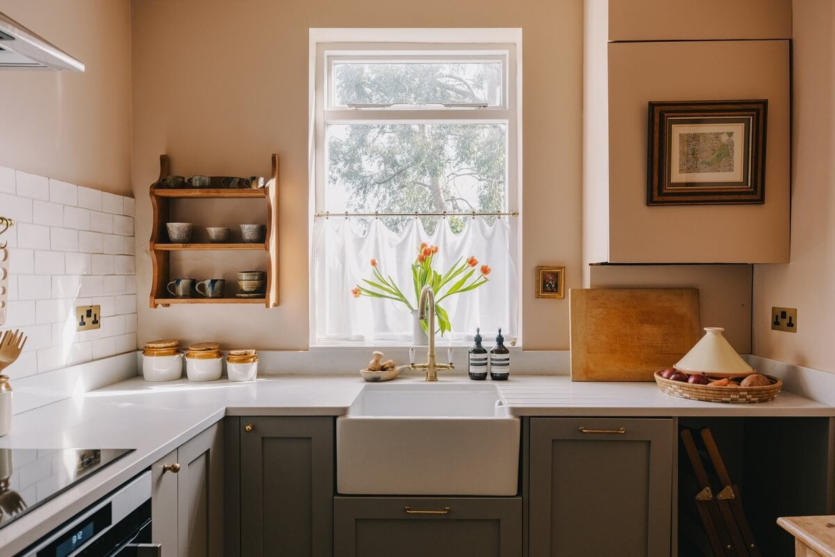 A Small London Apartment Filled with Books 9 kitchen butler sink setting plaster farrow and ball nordroom
