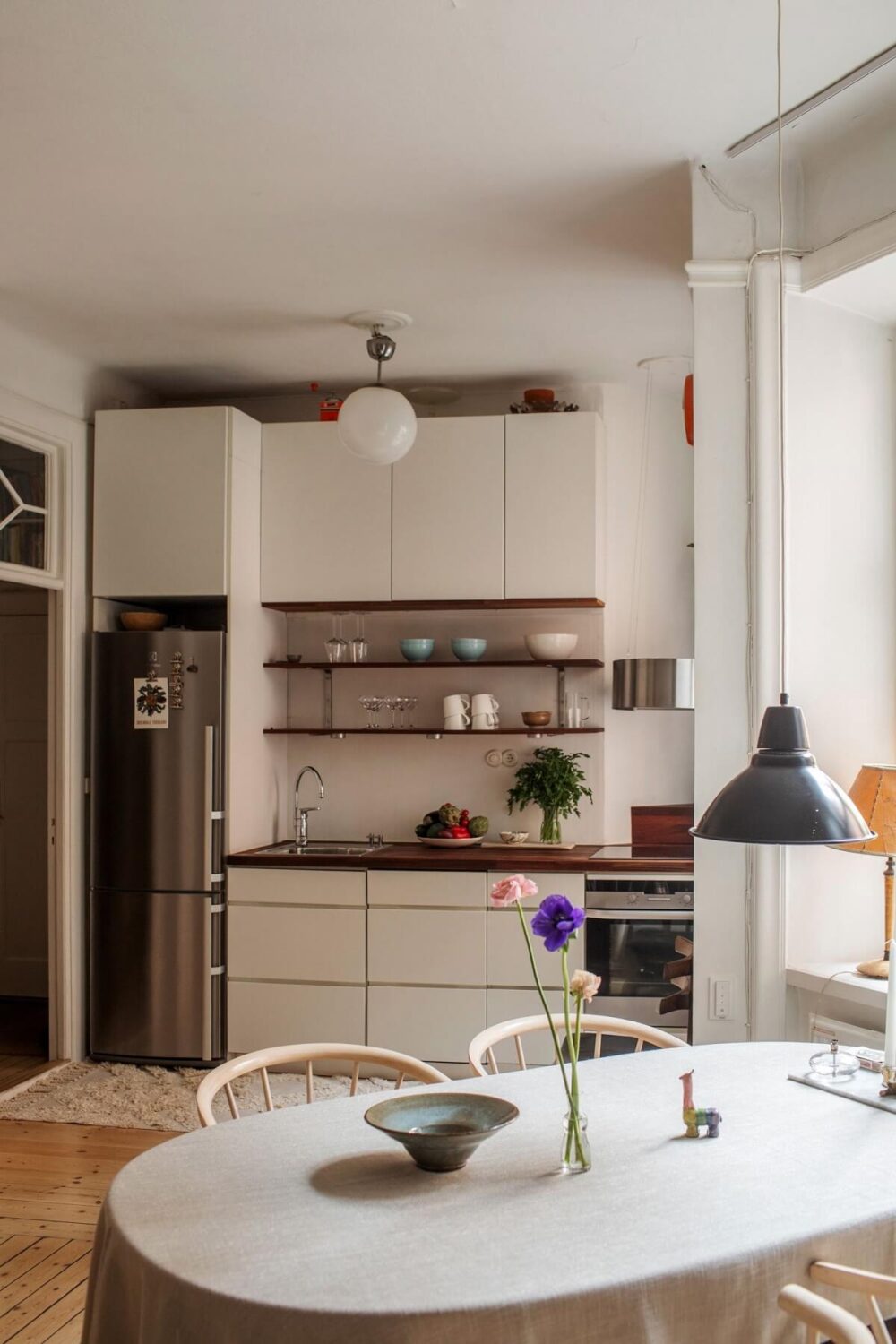 Period Details and Light Rooms in a Scandinavian Apartment 8 kitchen dining table
