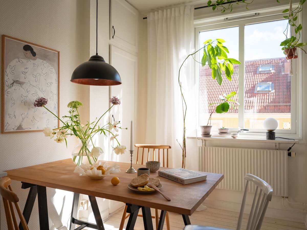 Calm Color Tones in a Light Scandinavian Studio Apartment 11 kitchen dining table