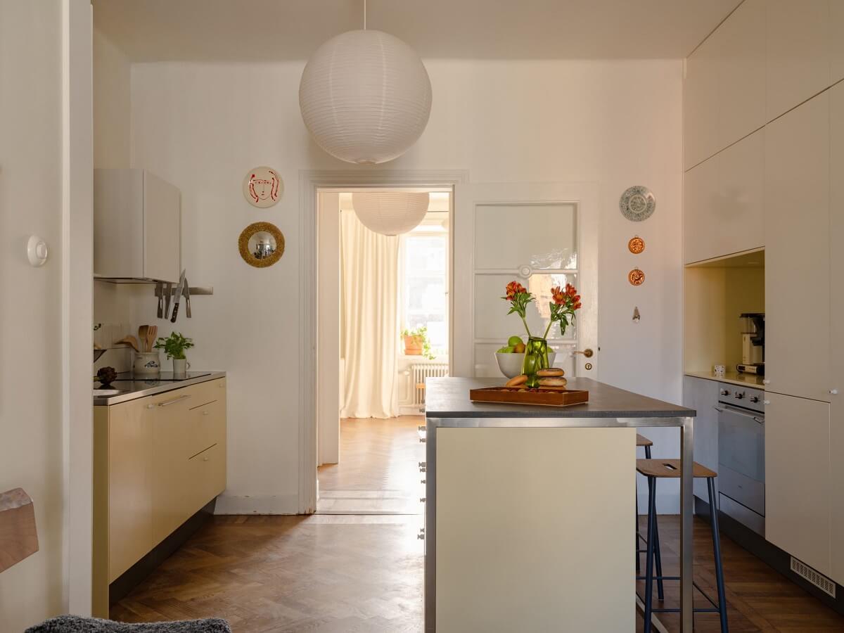 A Stockholm Apartment with Bright Green Color Accents 8 kitchen island