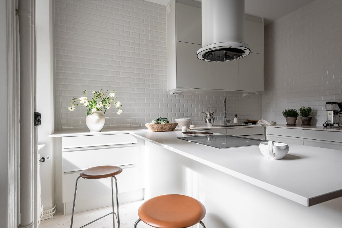 A Stylish Light Gray Swedish Apartment 11 kitchen island with bar seating