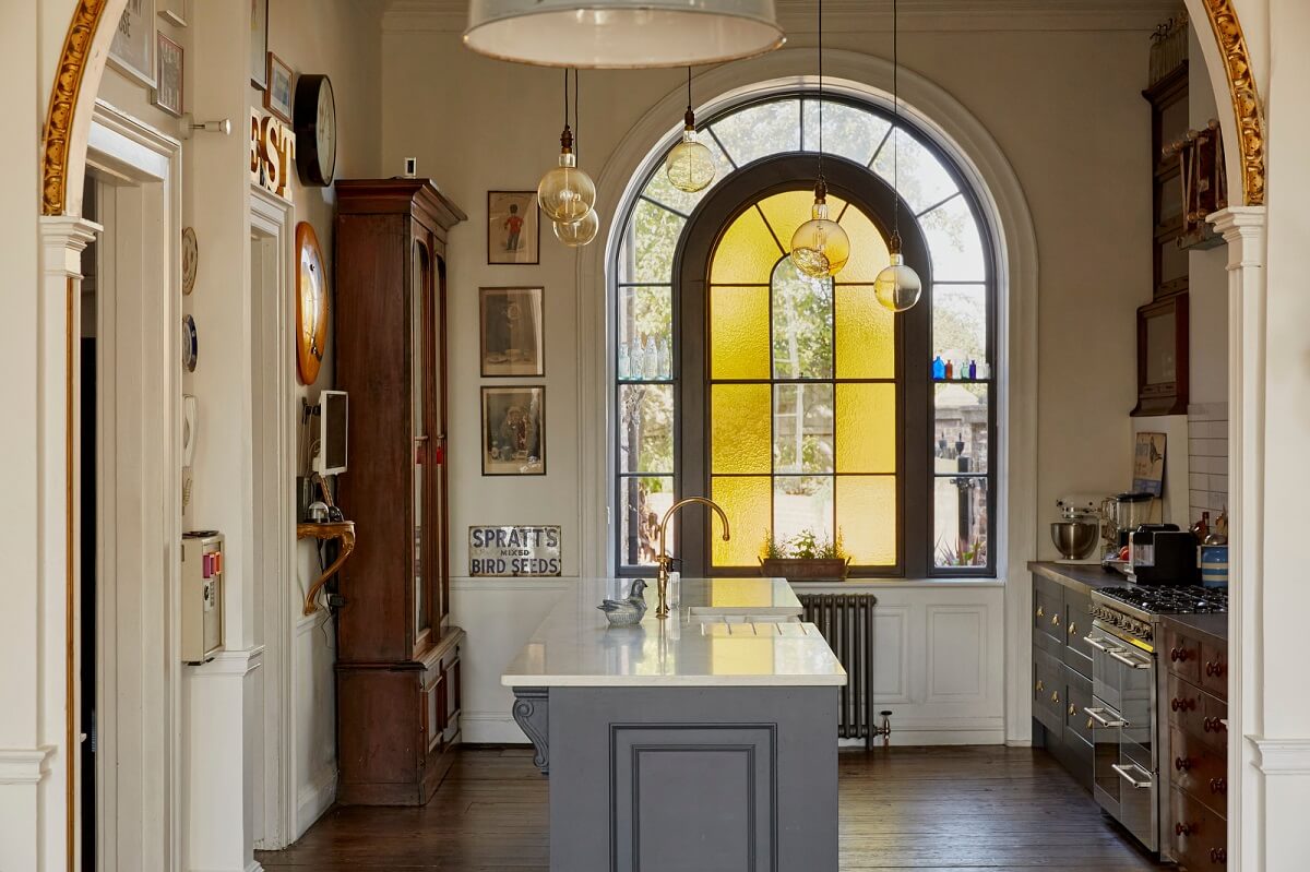 A Georgian House in England with a Ballroom 4 kitchen with arched window and island