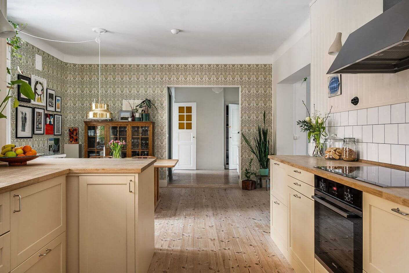 A Swedish Family Apartment with a Butter Yellow Kitchen 4 kitchen with butter yellow cabinets