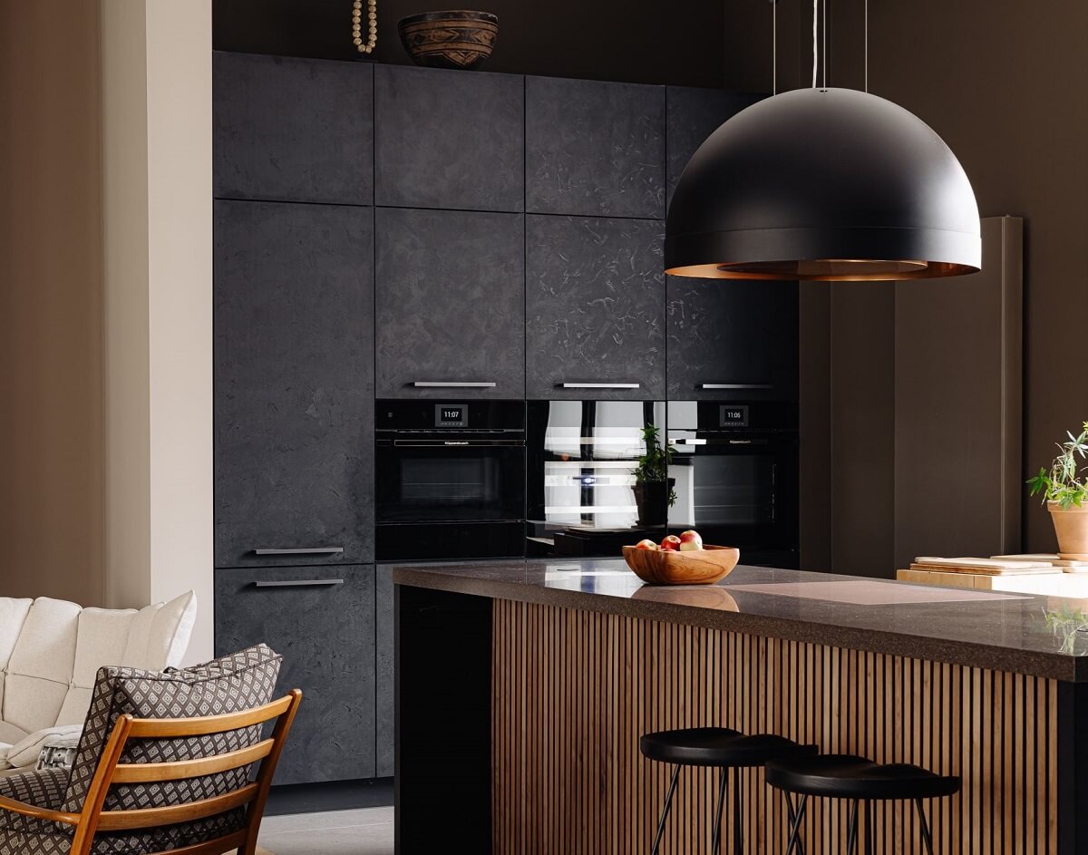 A Modern Garage Conversion in The Netherlands 8 kitchen with large pendant and bar seating