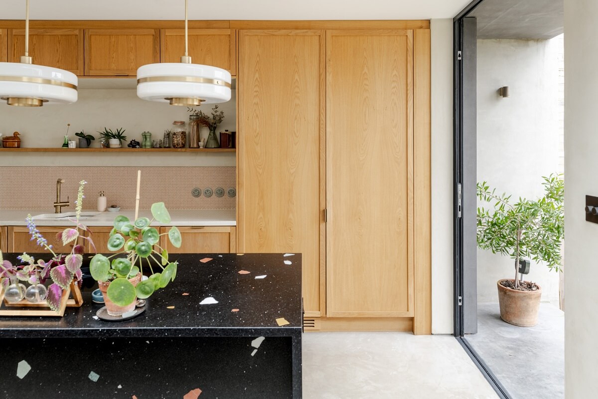 A Light London Family House with a Modern Extension 7 kitchen with oak cabinets and terrazzo island