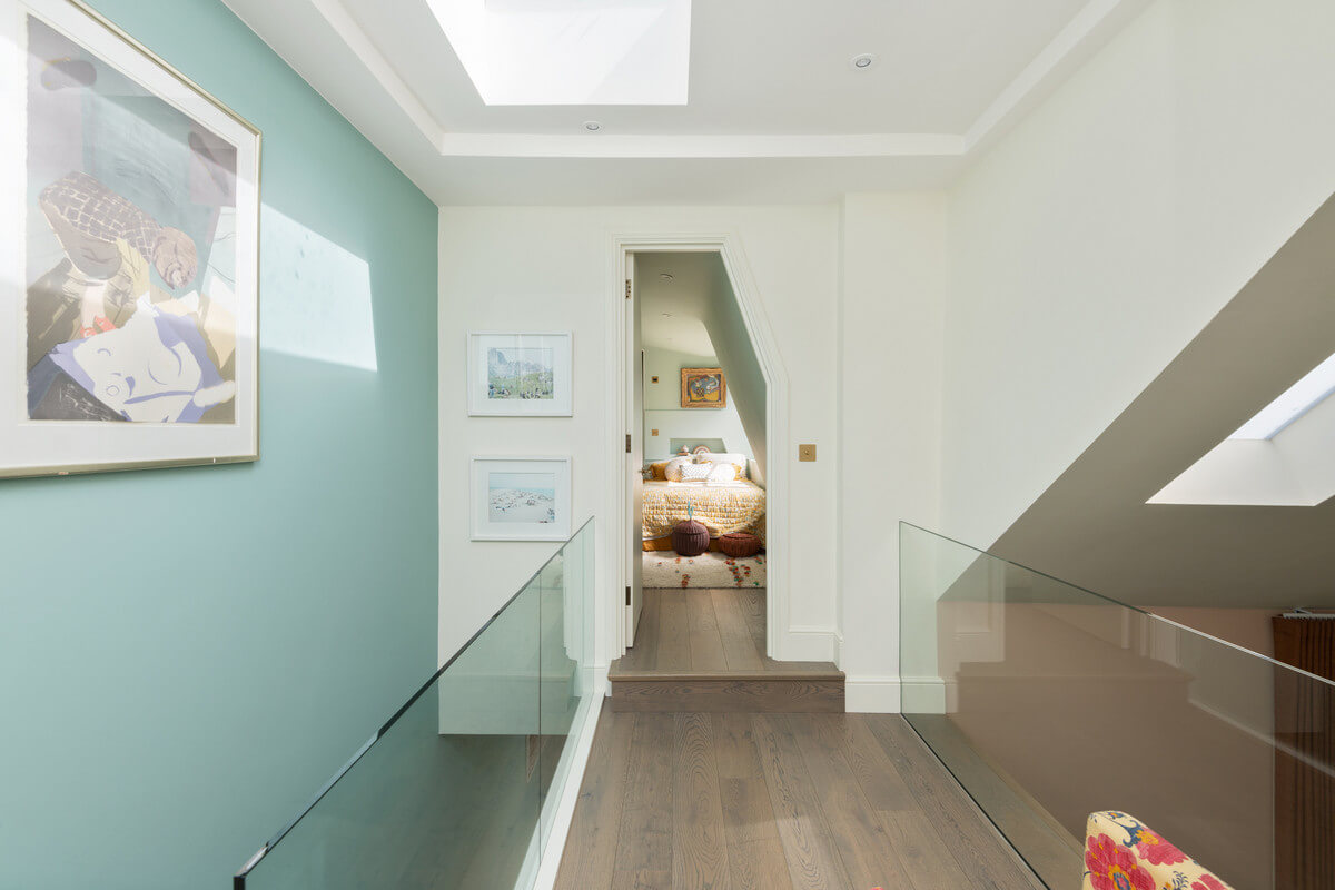 A Light London Maisonette in a Former Artist's Studio 17 landing with blue wall