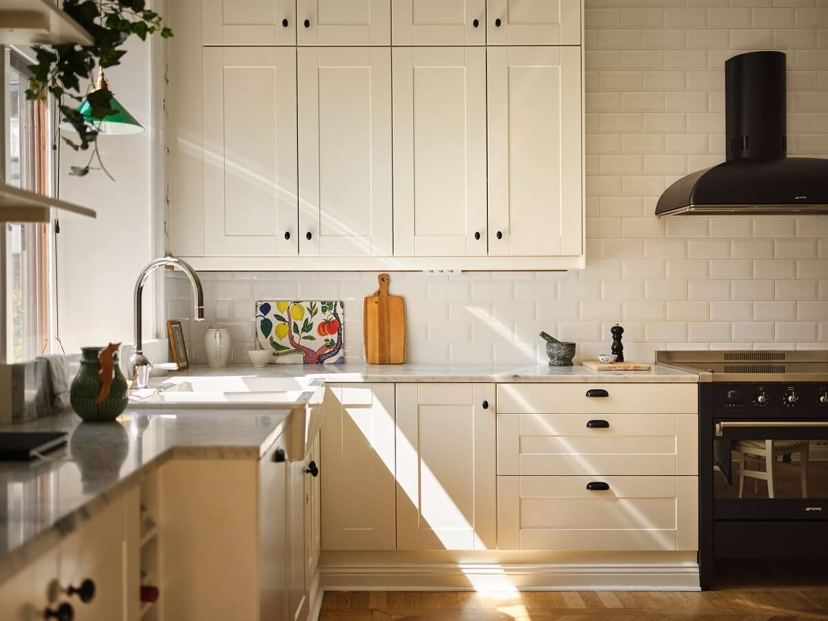 A Classic Stockholm Apartment with Floral Wallpaper 14 light filled kitchen nordroom