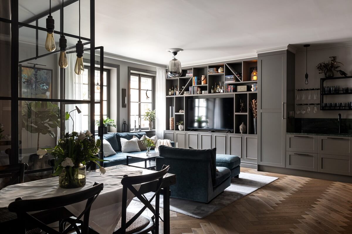 A Gray Apartment with an Industrial Glass Bedroom 1 living room and kitchen with industrial glass walls