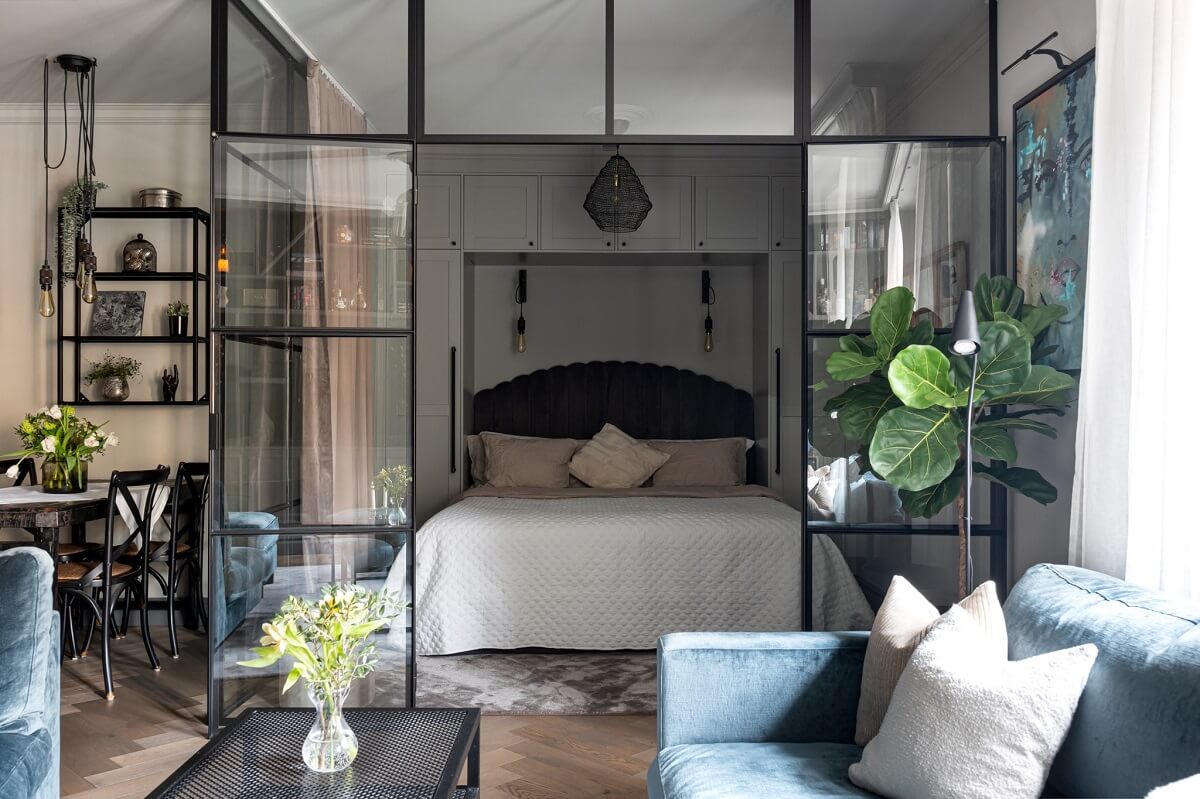 A Gray Apartment with an Industrial Glass Bedroom 11 living room view into bedroom