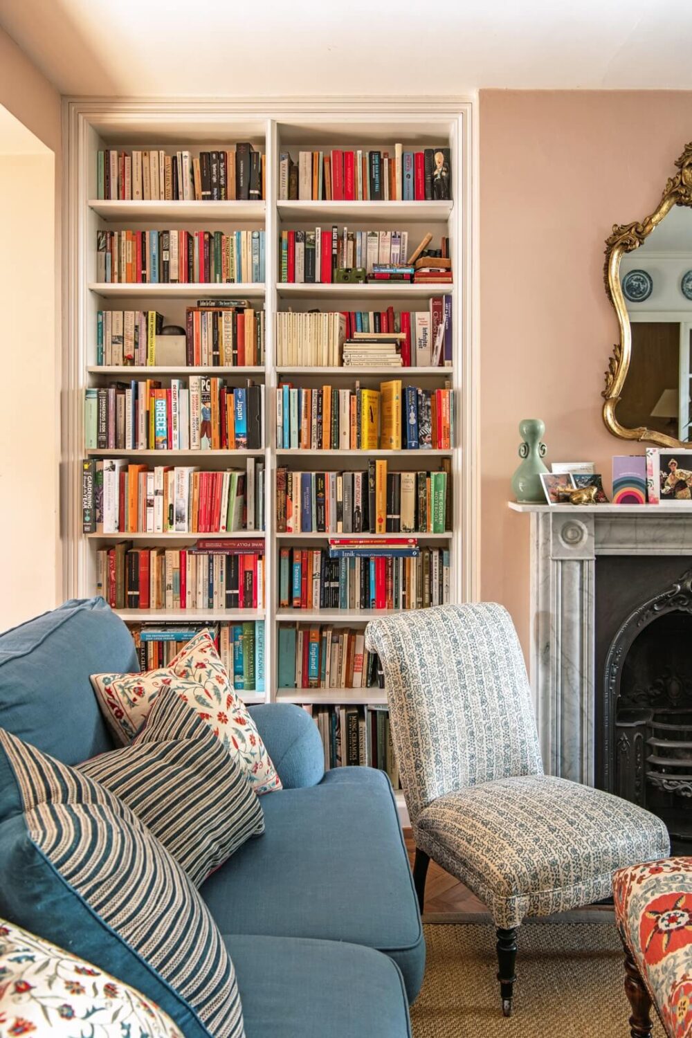 A Colorful Neo-Georgian House in London 3 living room with built in bookcases