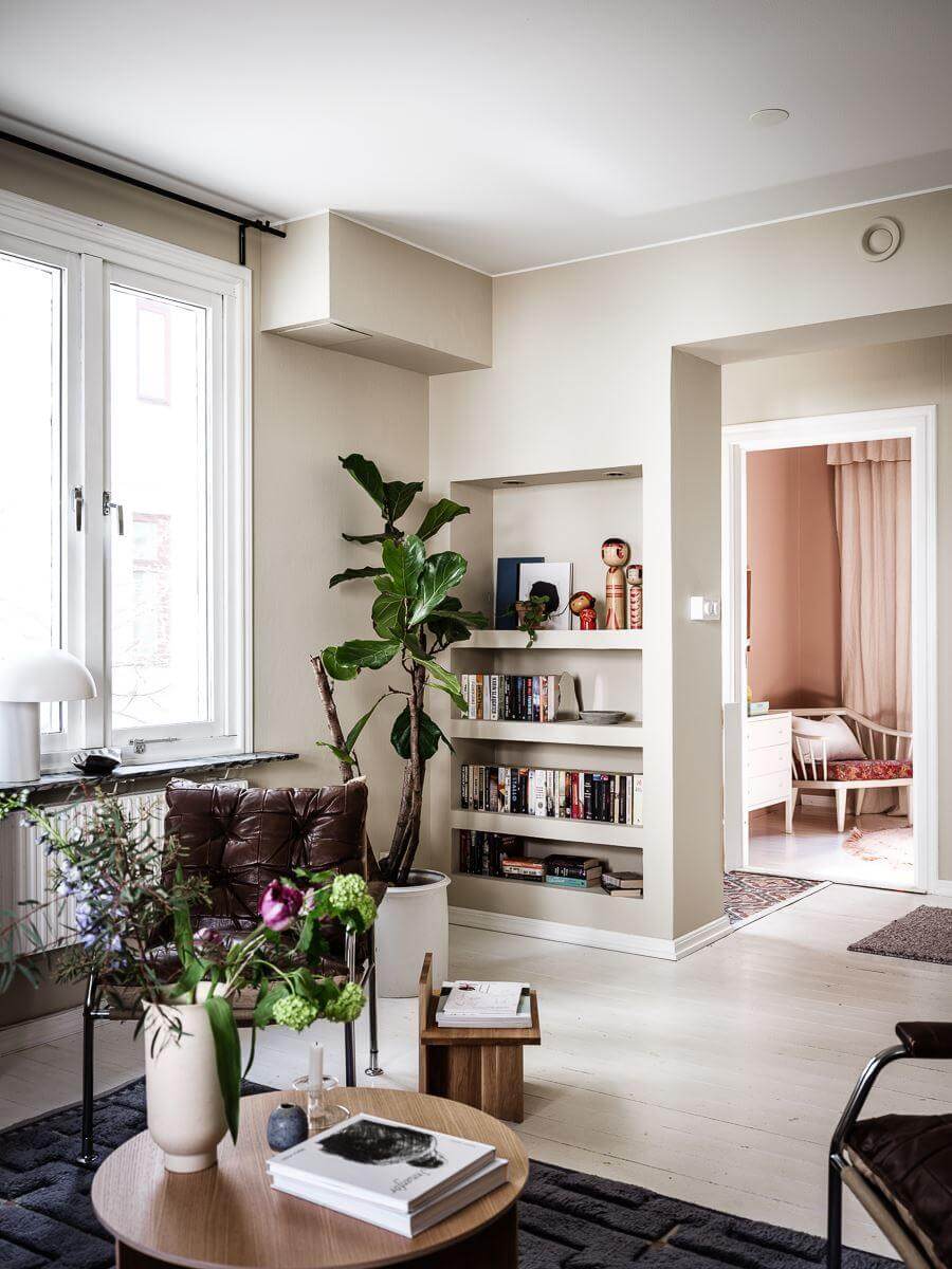 A Scandinavian Apartment with a Rust Red Bedroom 7 living room with built in bookshelves