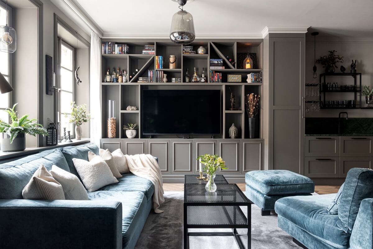 A Gray Apartment with an Industrial Glass Bedroom 3 living room with custom cabinets and television spot
