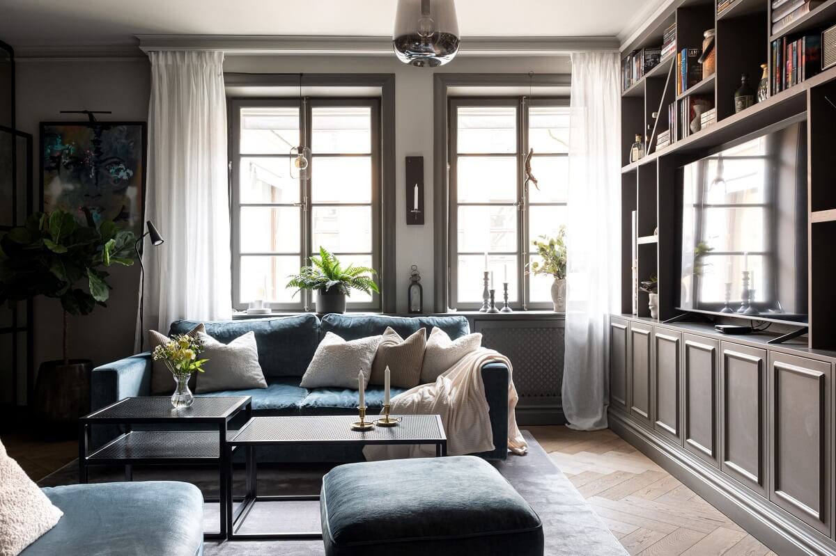 A Gray Apartment with an Industrial Glass Bedroom 2 living room with custom storage