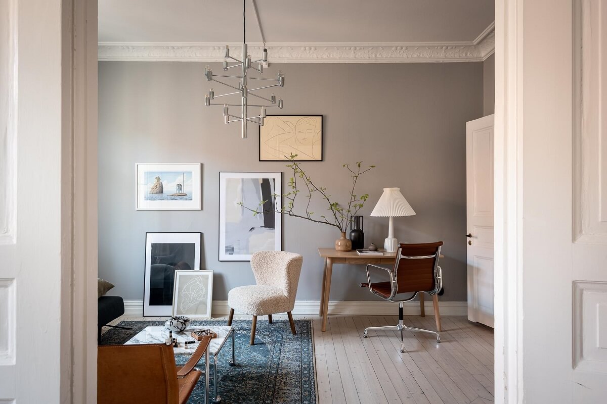 A Stylish Light Gray Swedish Apartment 13 living room with desk and gray walls