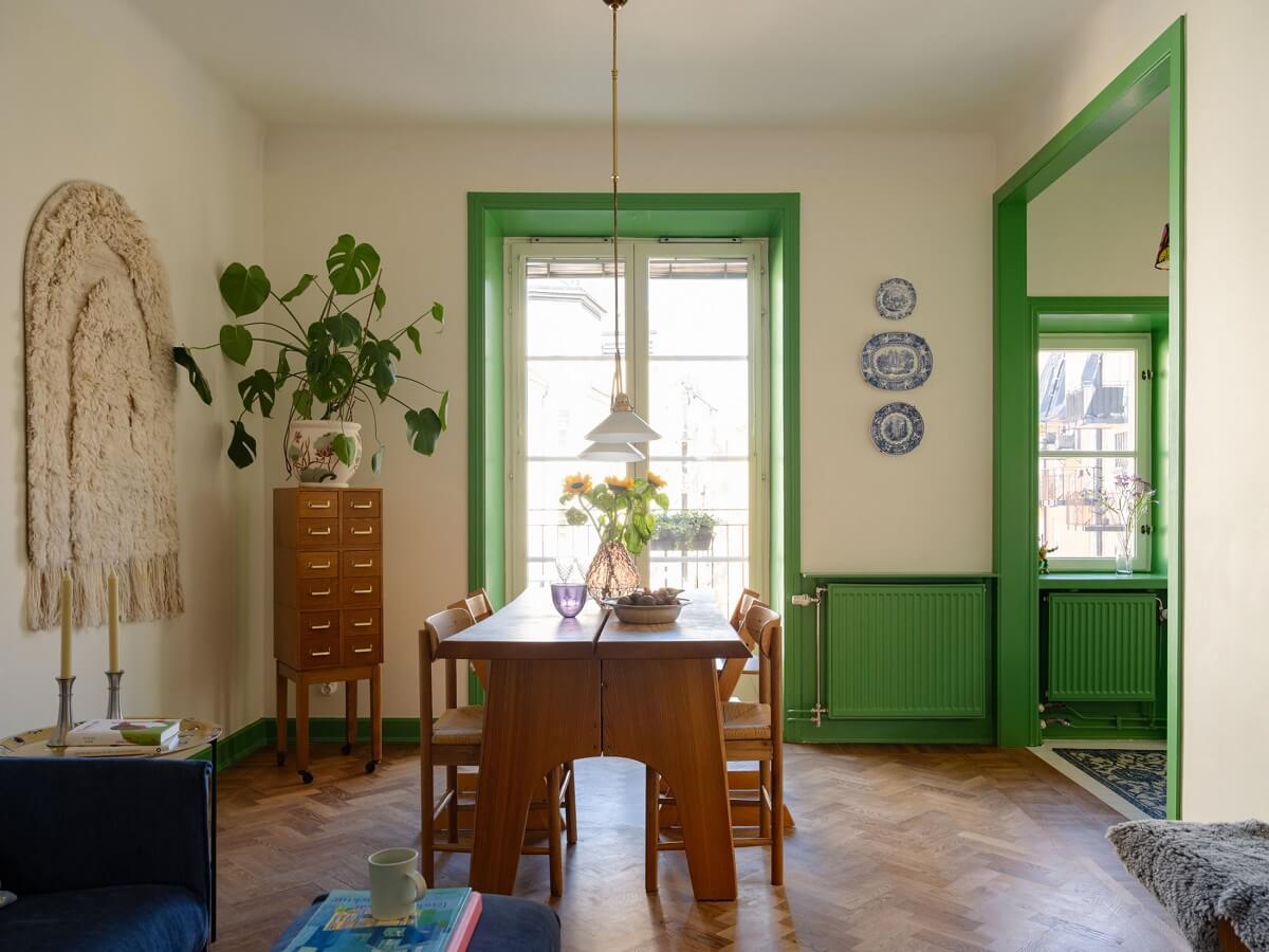 A Stockholm Apartment with Bright Green Color Accents 2 living room with green window trims