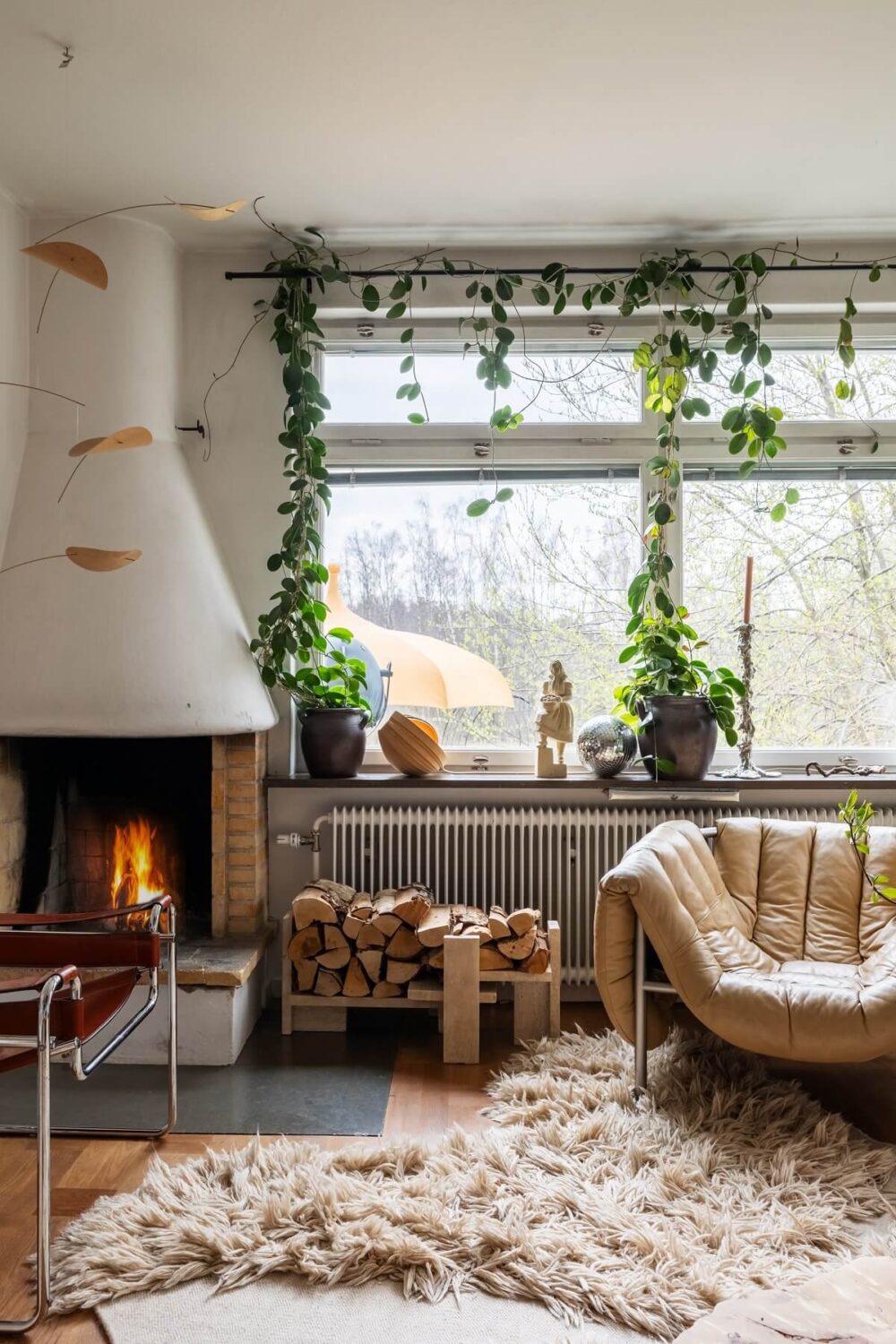 A Swedish Family House with Wall Murals and Art 3 living room with shag rug and fireplace