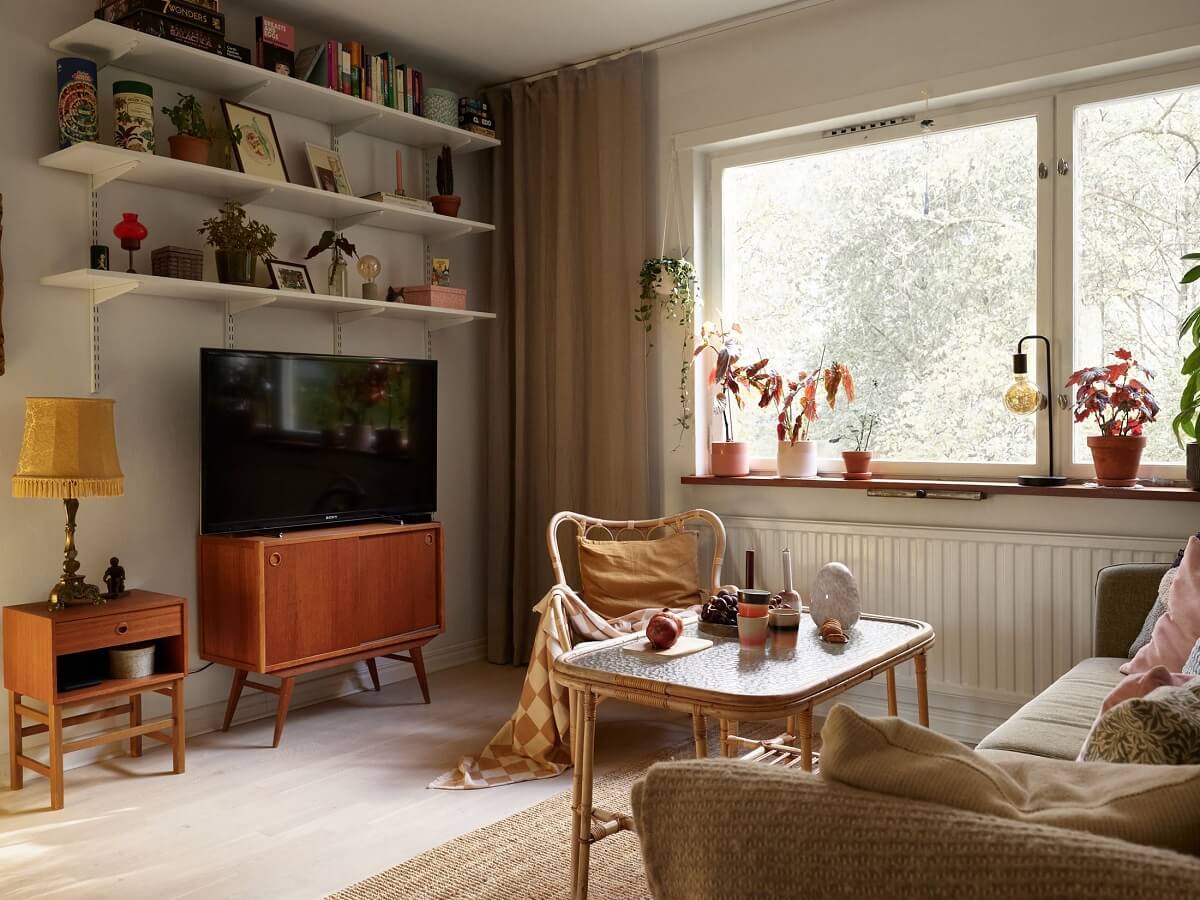 A Swedish Apartment with a Tiny Terracotta Brown Bedroom 5 living room with shelves