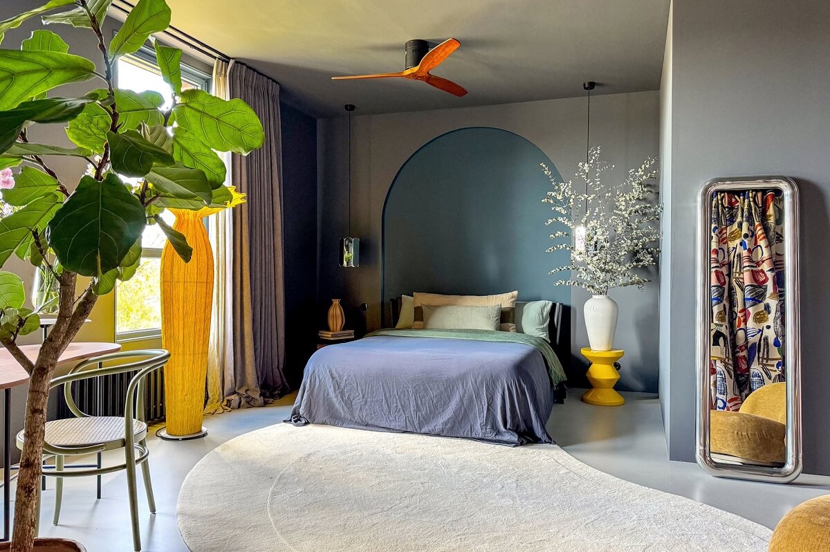 Color and Graphic Design in the Home of a Dutch Interior Stylist 23 master bedroom with arch