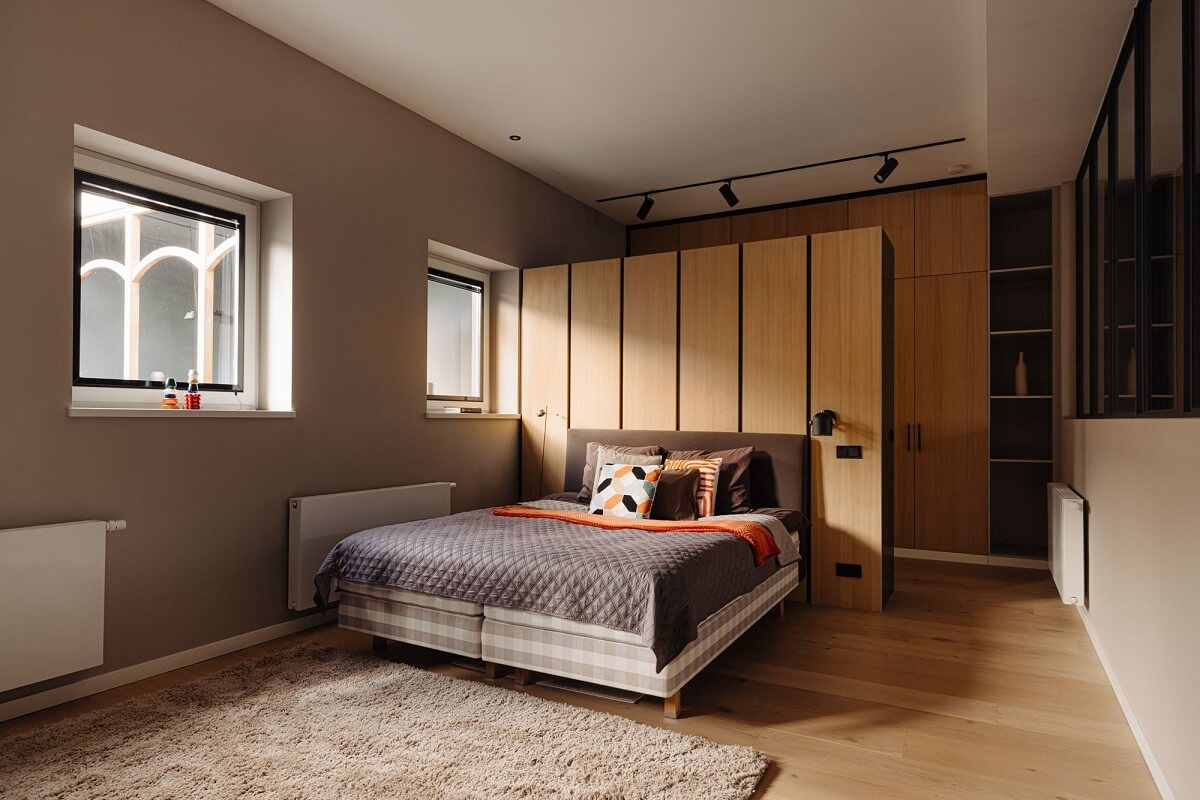 A Modern Garage Conversion in The Netherlands 16 master bedroom with wardrobes