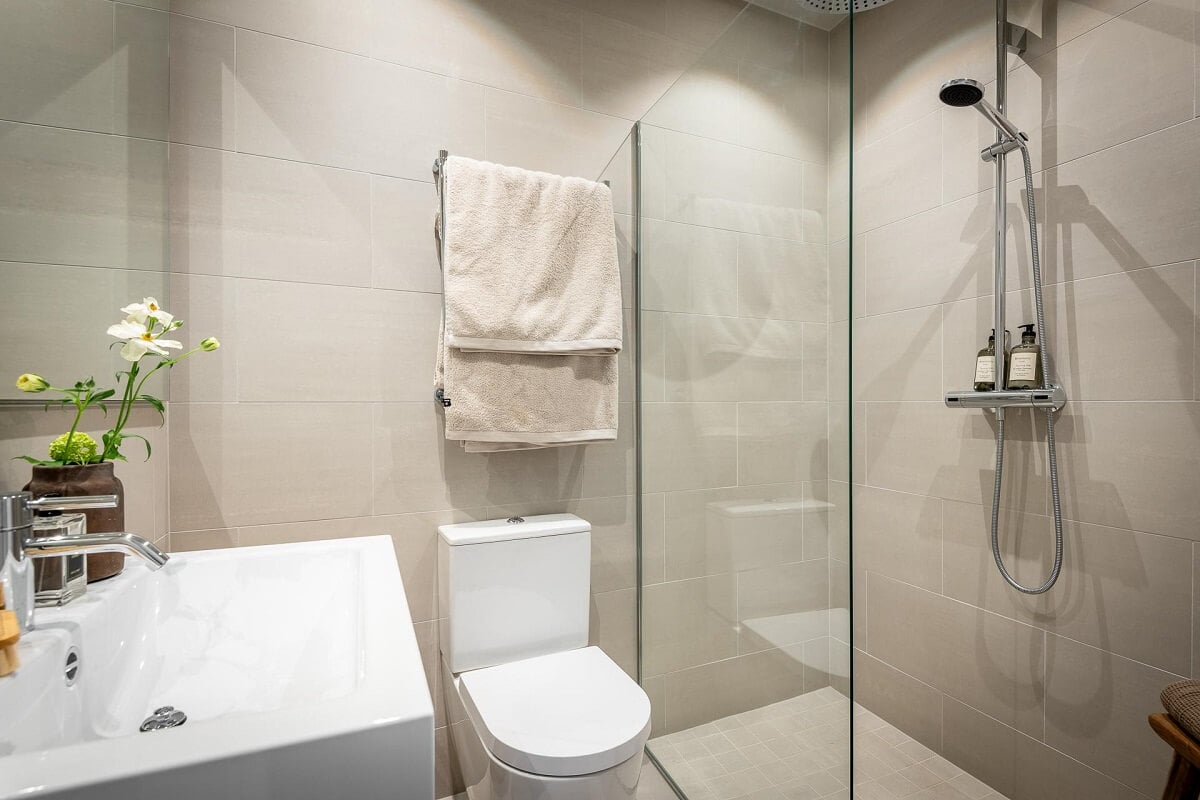 An Attic Studio Apartment with a Glass Room Divider 19 minimalistic bathroom with walk in shower