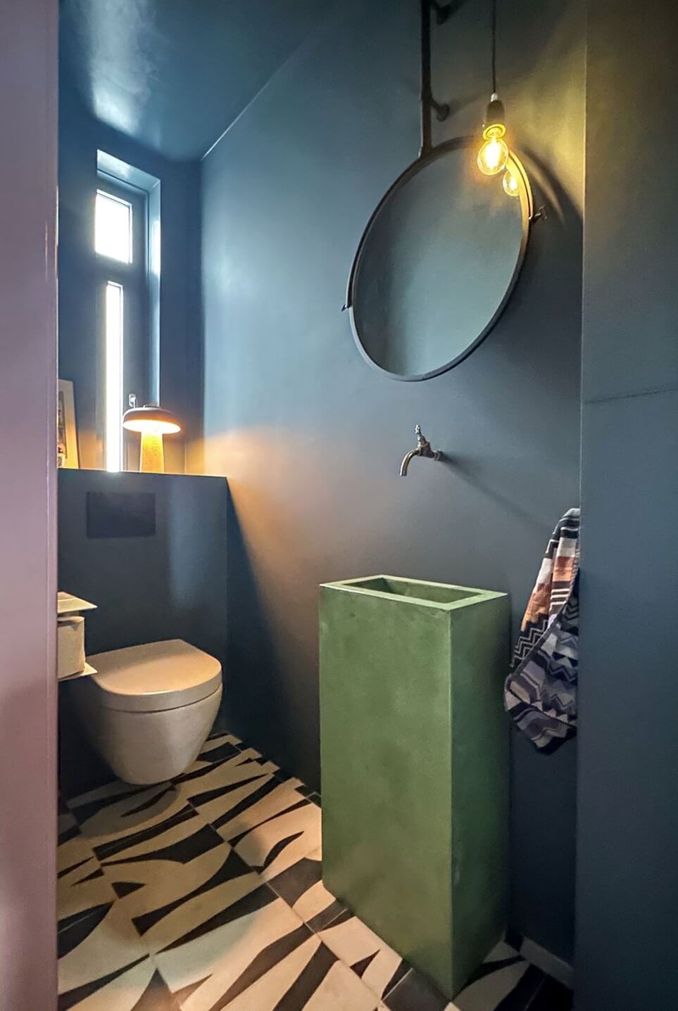 Color and Graphic Design in the Home of a Dutch Interior Stylist 40 moody powder room