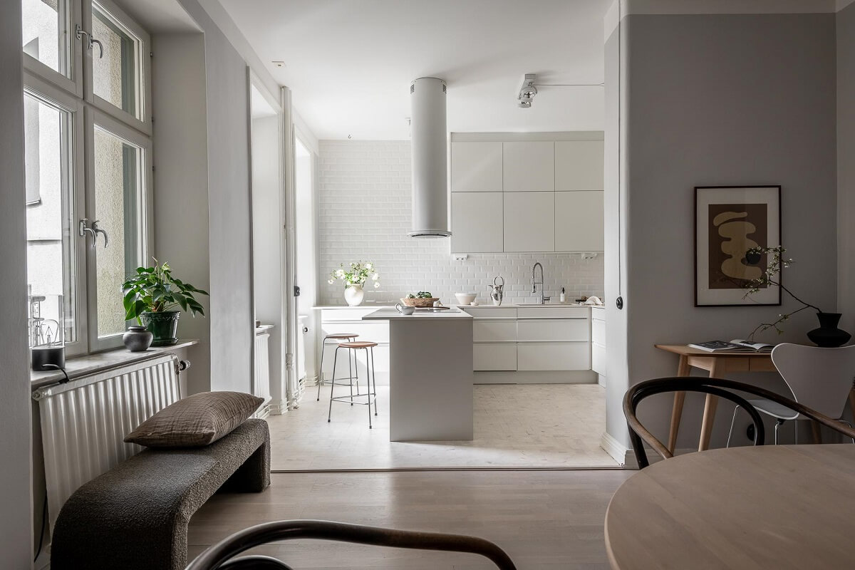 A Stylish Light Gray Swedish Apartment 9 open plan dining room with kitchen