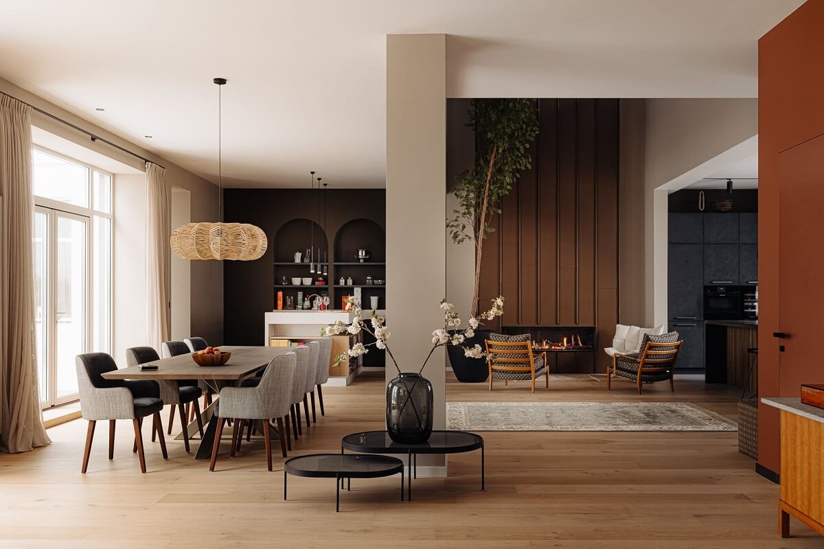 A Modern Garage Conversion in The Netherlands 12 open plan kitchen dining space with fireplace