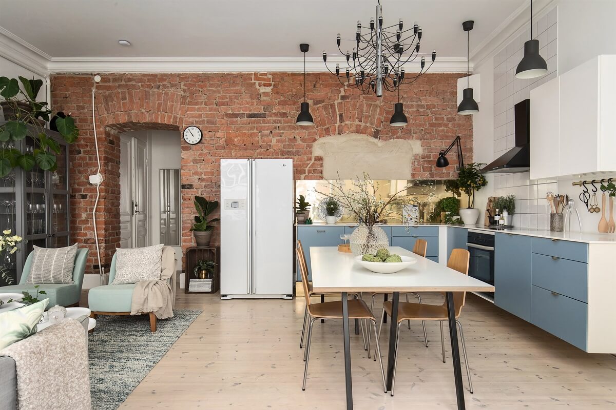 A Swedish Apartment with an Exposed Brick Wall 4 open plan living room kitchen with brick wall