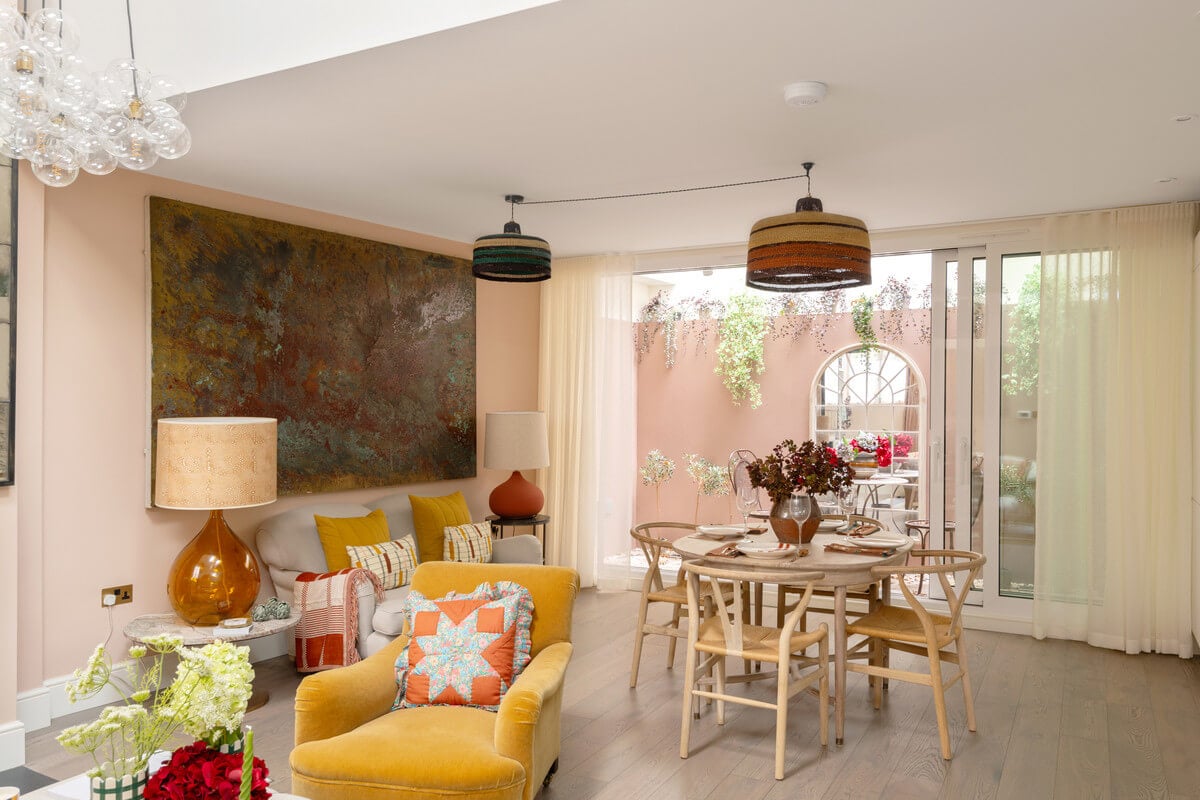 A Light London Maisonette in a Former Artist's Studio 7 open plan living room with pink walls and yellow chair