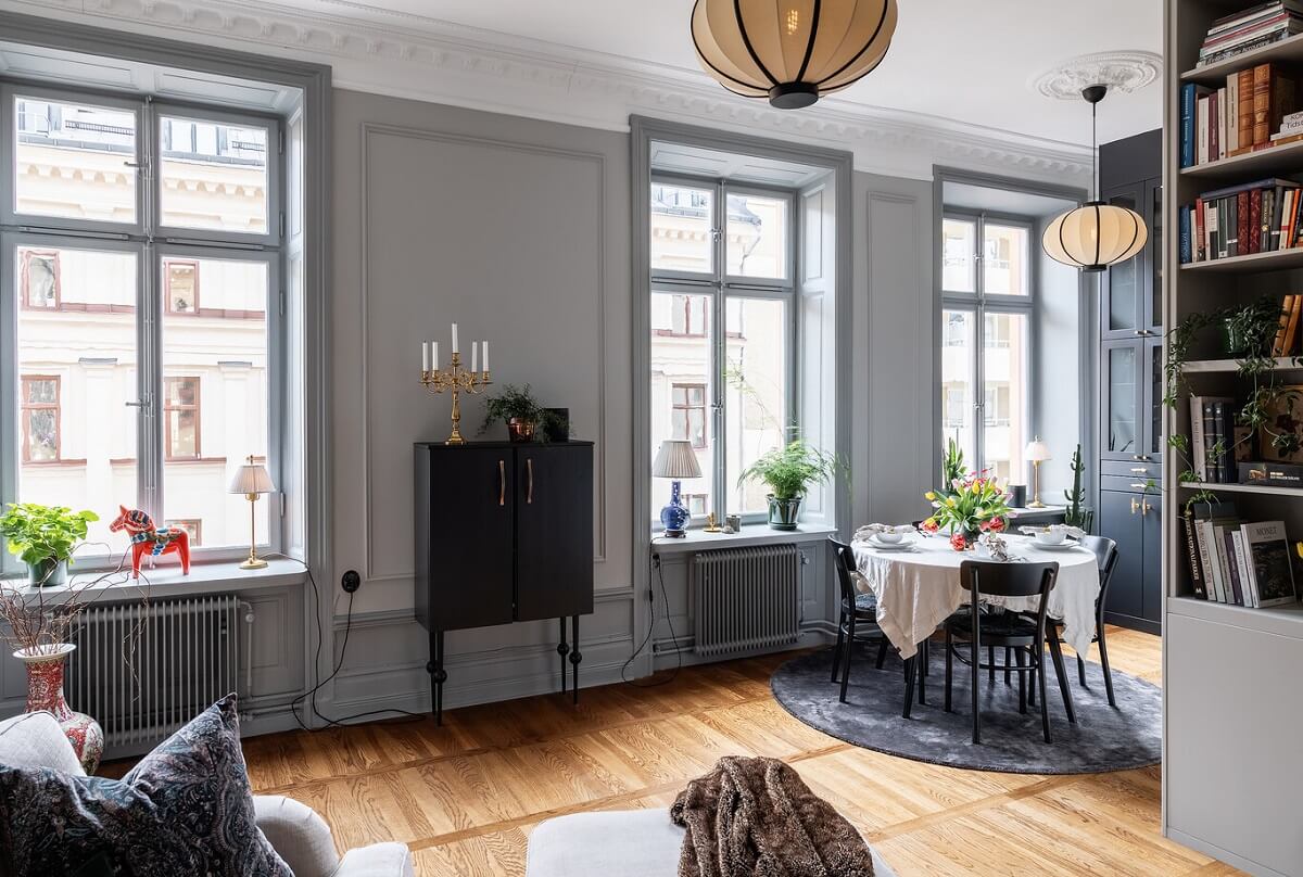 A Classic Swedish Apartment with a Dark Blue Bedroom 4 open plan living space with light gray walls