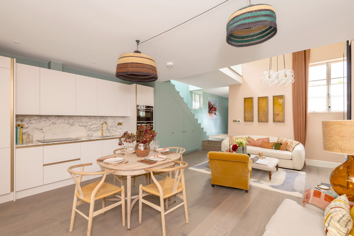 A Light London Maisonette in a Former Artist's Studio 9 open plan living space with pastel pink walls and white kitchen